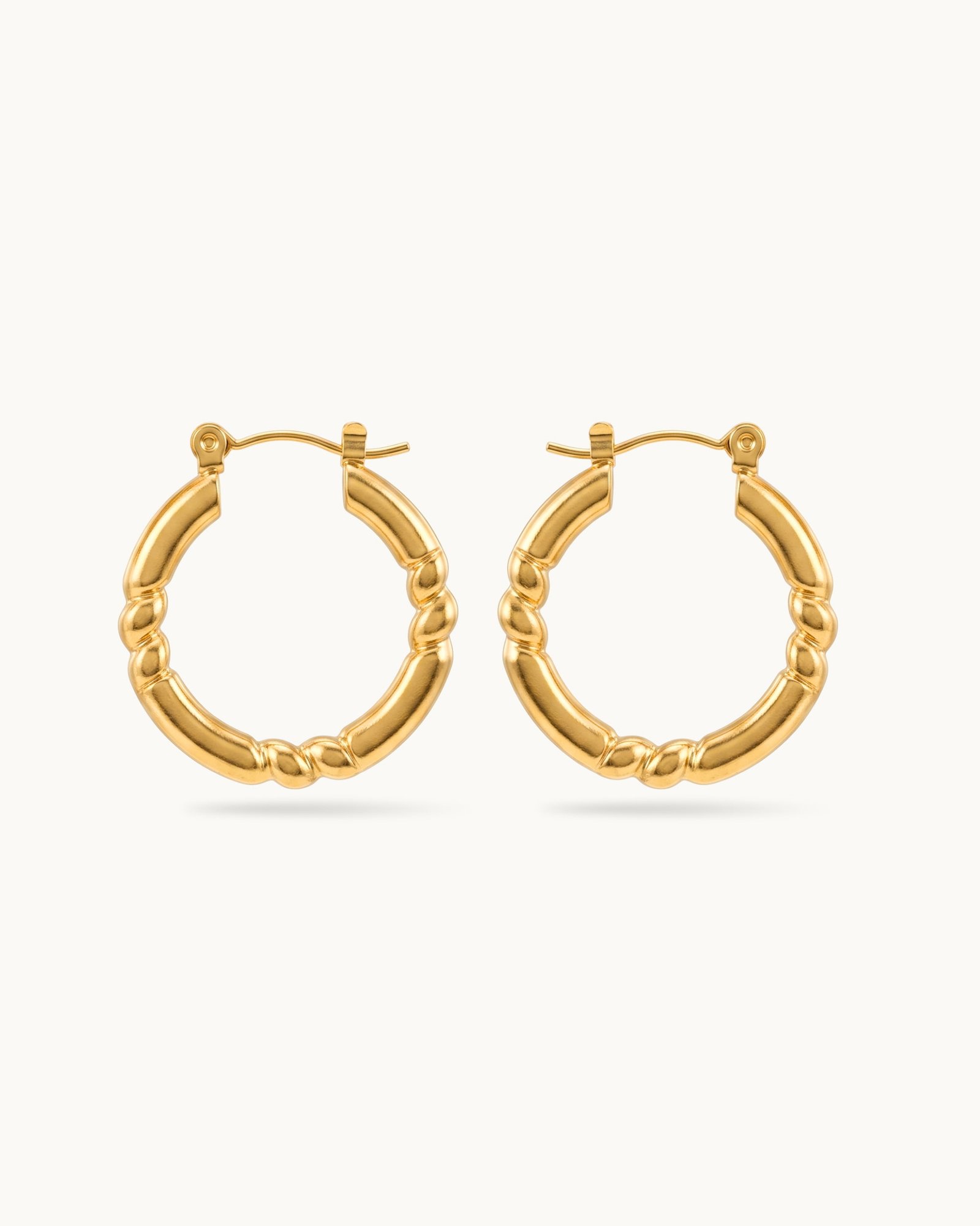 twist-muse-hoop-earrings Twist Muse Hoop Earrings - Image 1